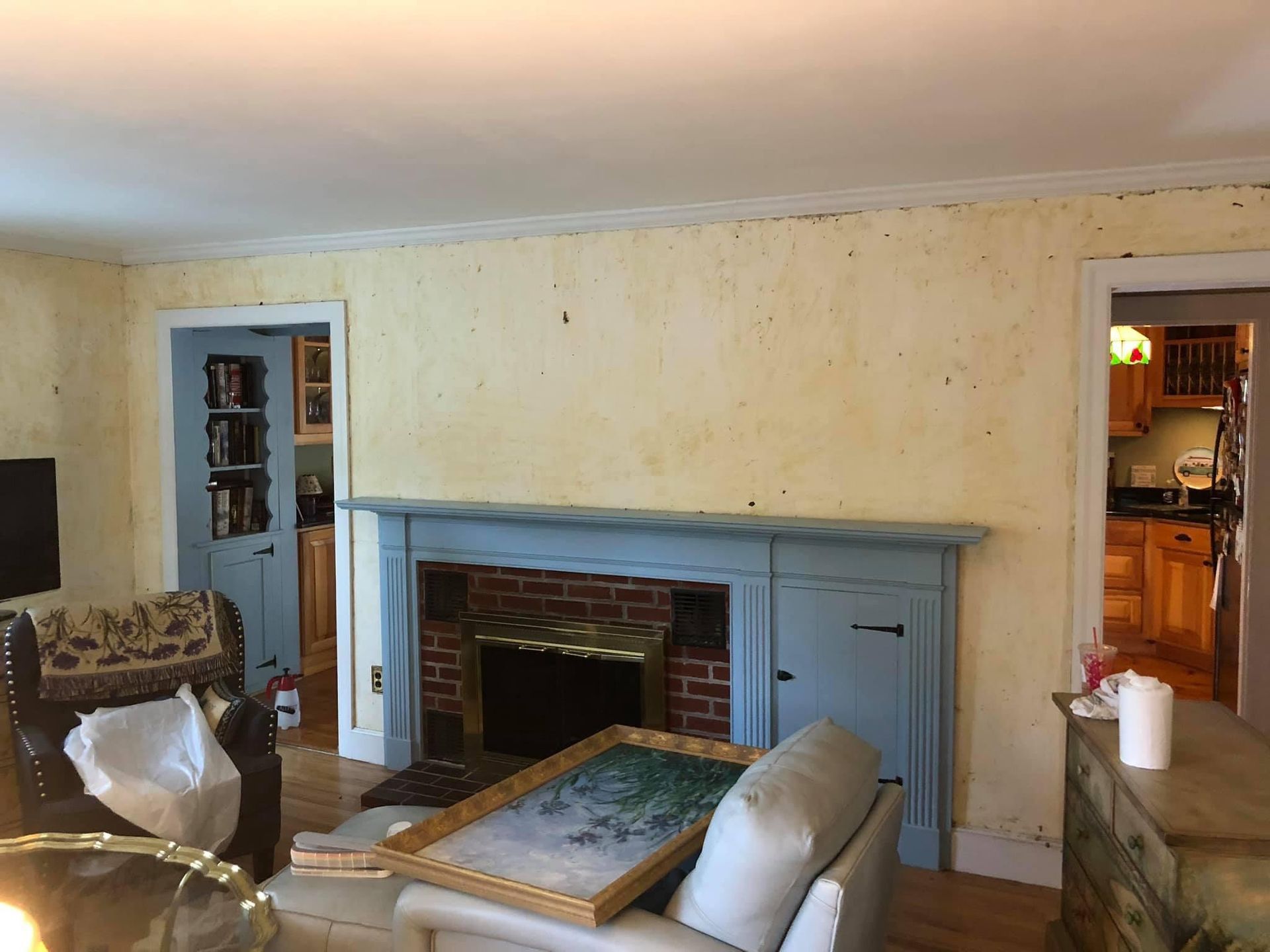 A living room with a fireplace and a couch