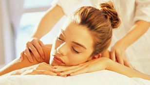 A woman is getting a massage at a spa.