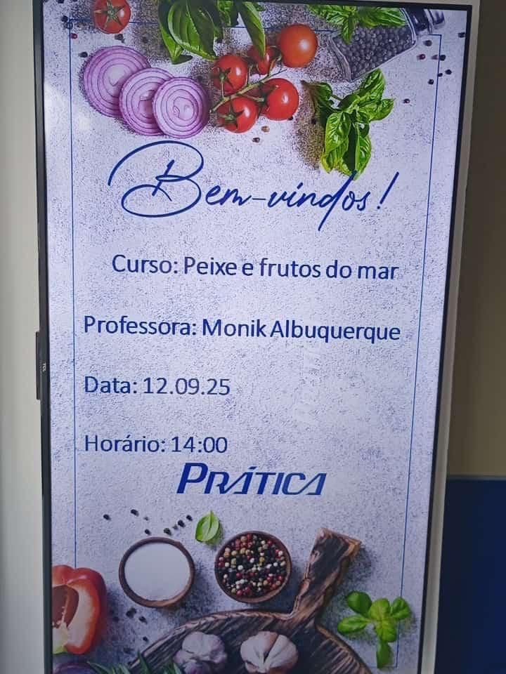 Placa promovendo uma aula de culinária de frutos do mar: 