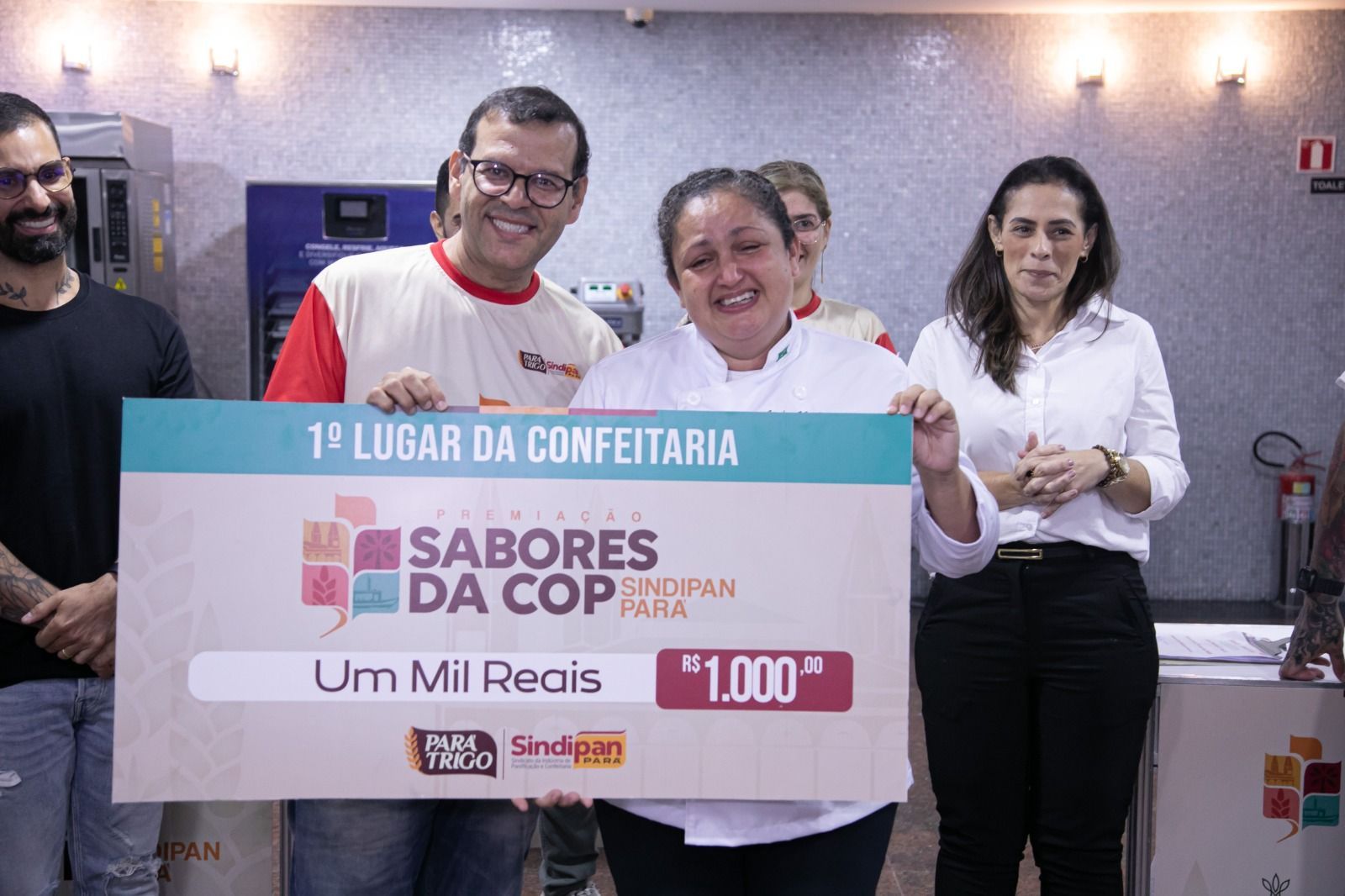 People holding a large check for 