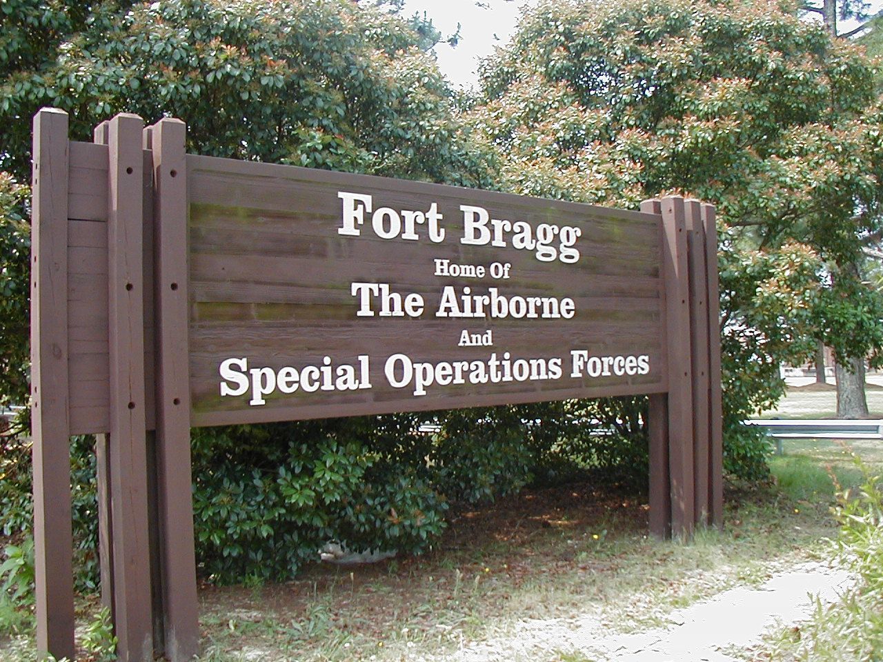 Wooden sign marking entrance to Fort Bragg, home of The Airborne and Special Operations Forces near Eastover, NC.