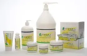 A group of bottles , jars , tubes , and a box of sombra products.