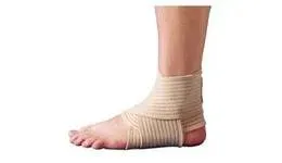 A person is wearing a bandage on their ankle.