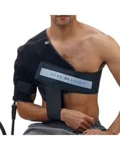 A shirtless man is wearing a black shoulder brace.