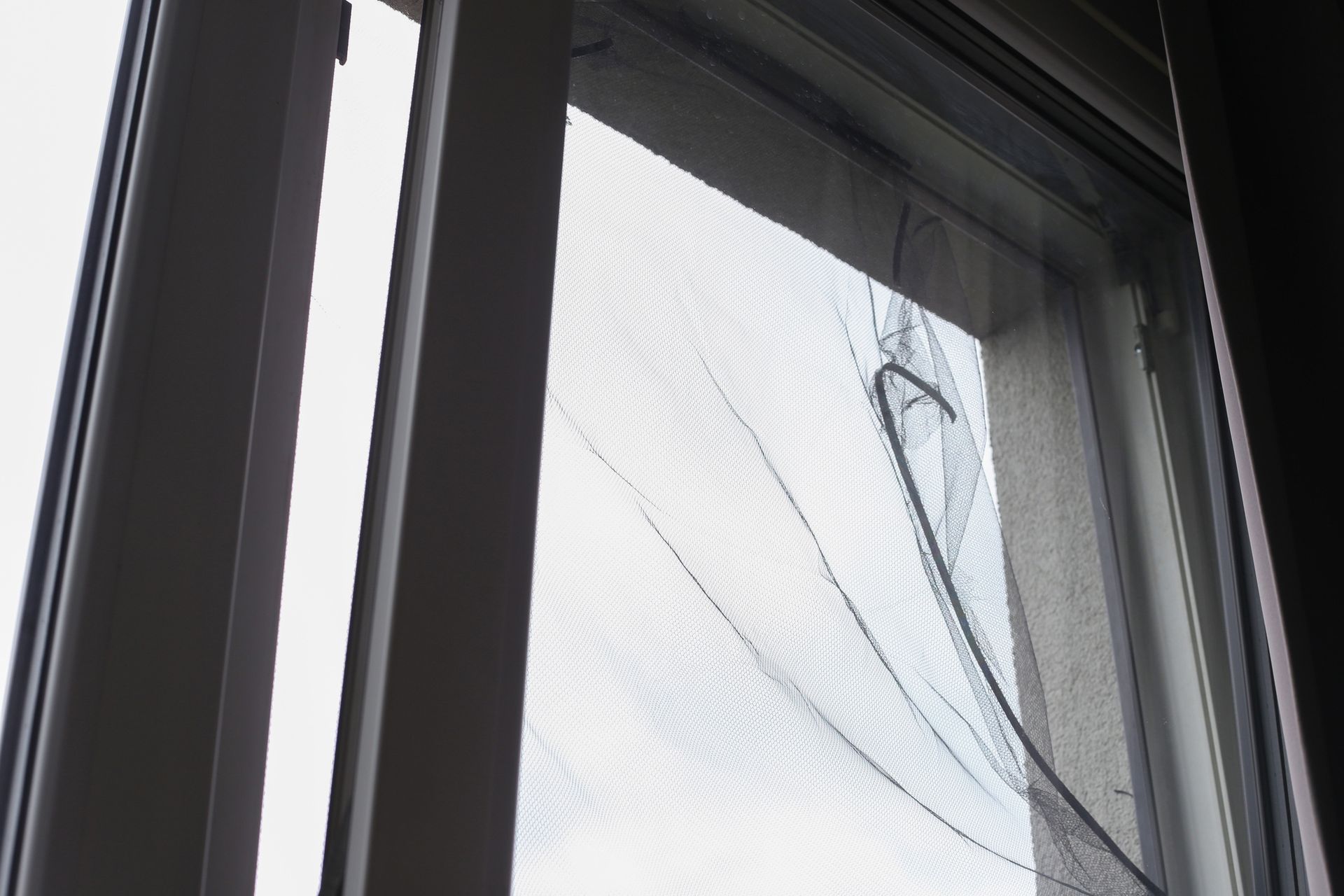A close up of a window with a broken screen.