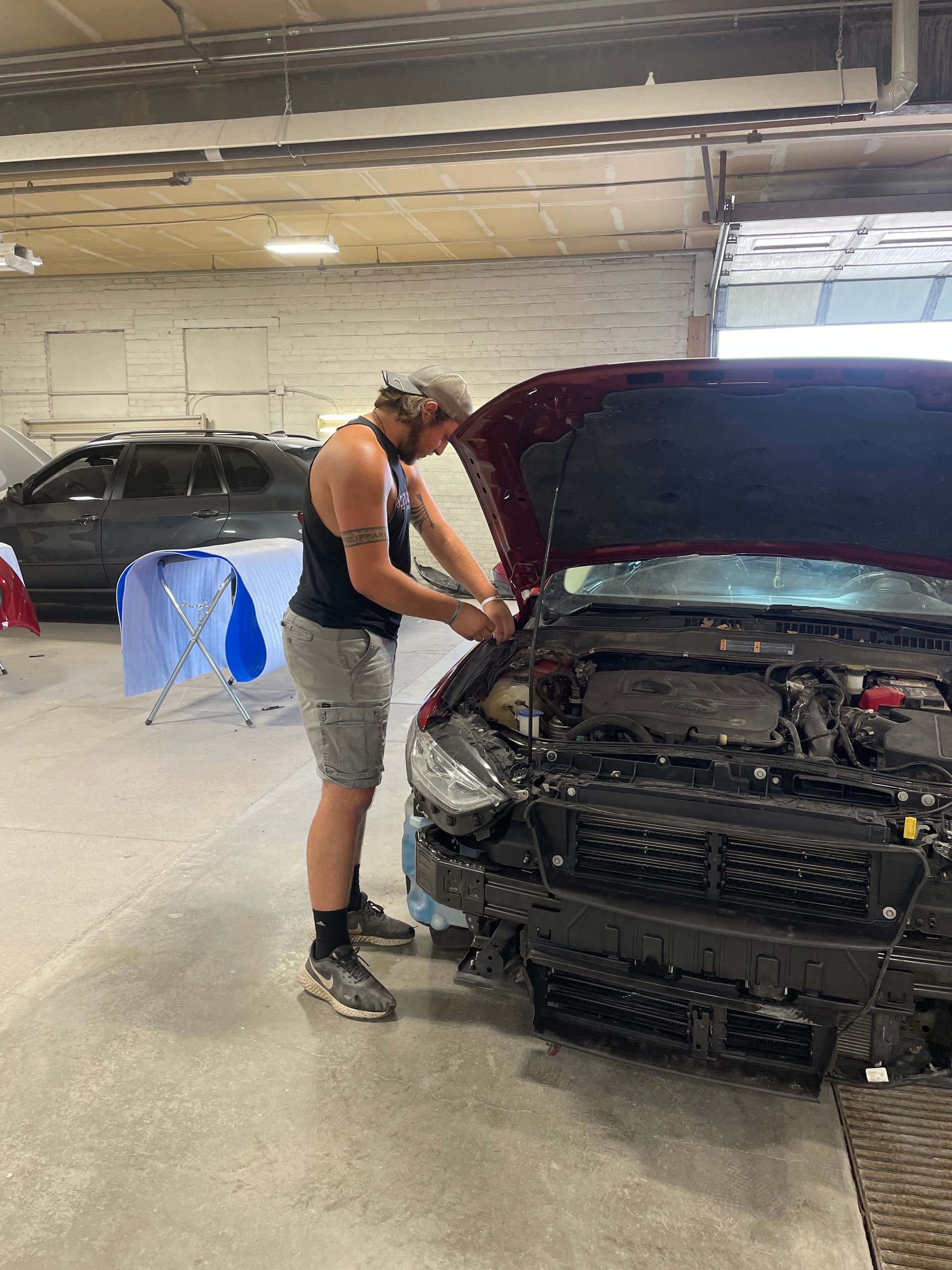 Man Repairing Pickup Truck - NE, United States - Sealey Body Shop