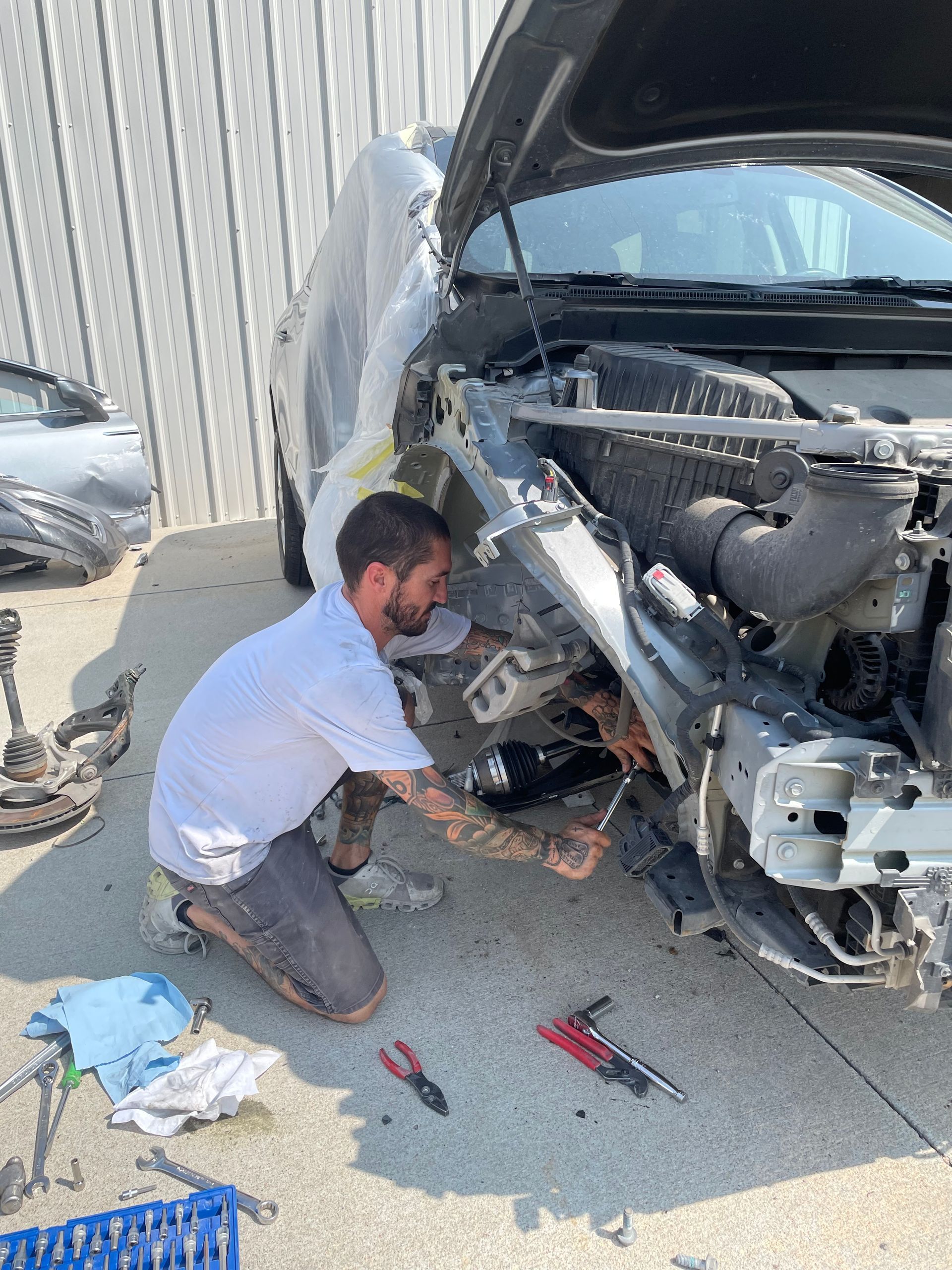 Man Repairing In Tire - NE, United States - Sealey Body Shop