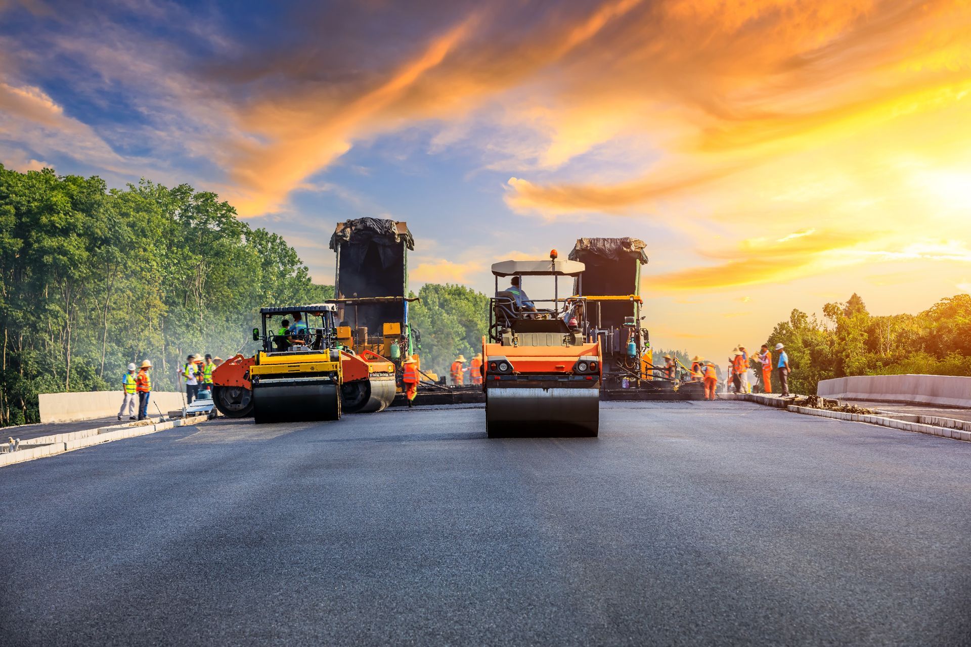 A Group of Construction Workers Are Working on a Road