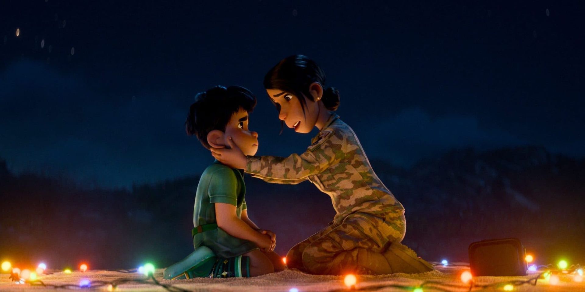 Elio and his aunt sit face to face on a dimly lit rooftop at night, holding each other gently amid colorful lights.