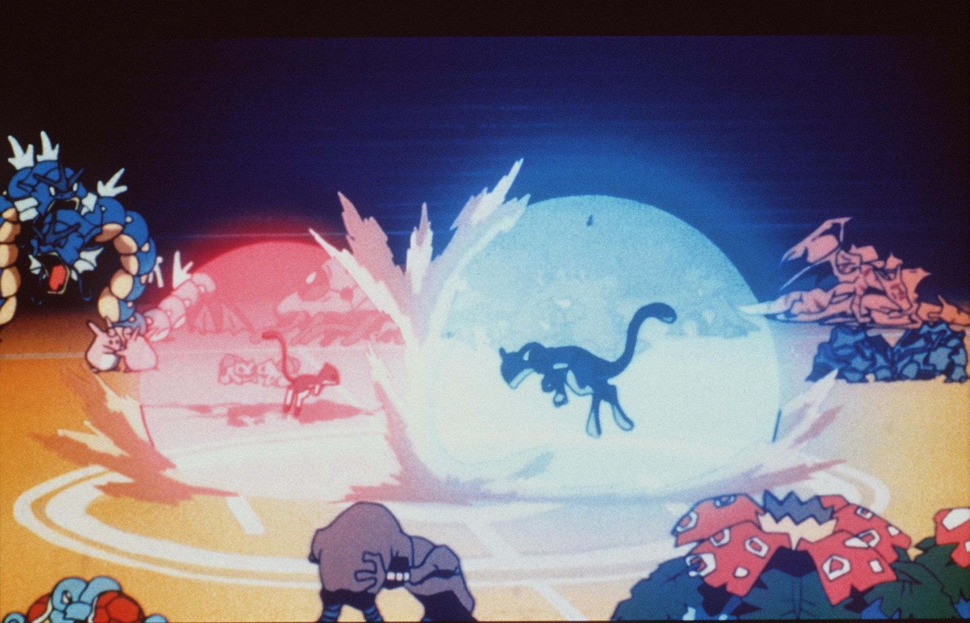 Cartoon battle scene with glowing red and blue energy spheres, silhouetted creatures, and fighters around the edges
