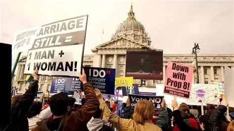 Protest against Prop 8 in San Francisco, with signs held up in front of a building.
