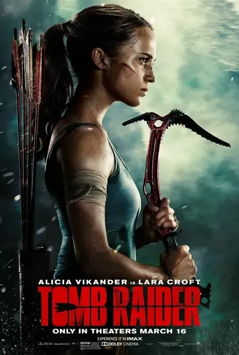 Lara Croft (Alicia Vikander) from Tomb Raider: holding an ice axe, side profile, determined expression, outdoor setting.