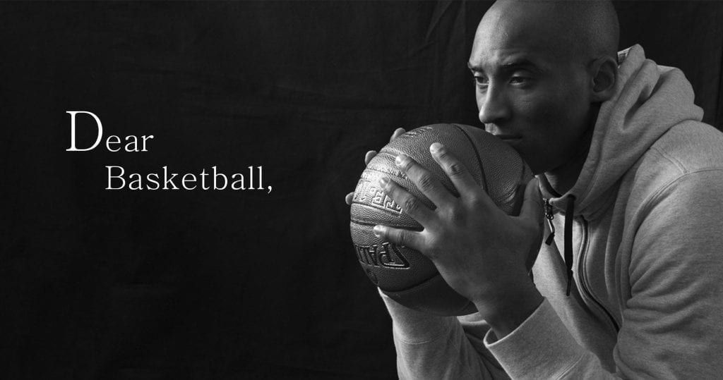Kobe Bryant holding and kissing a basketball, black and white photo. Text: