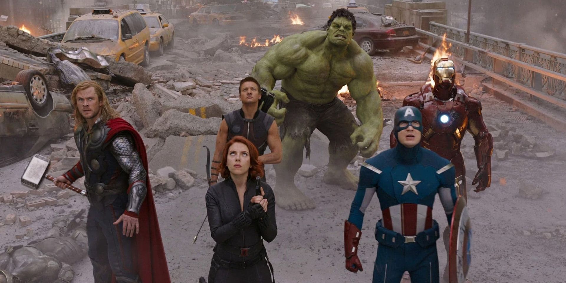Avengers assemble amid battlefield ruins, with Hulk, Captain America, Thor, Black Widow, Iron Man, and Hawkeye.