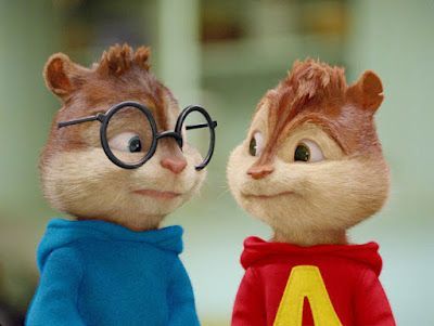 Simon and Alvin, cartoon chipmunks. Simon in blue, glasses; Alvin in red, both smiling.