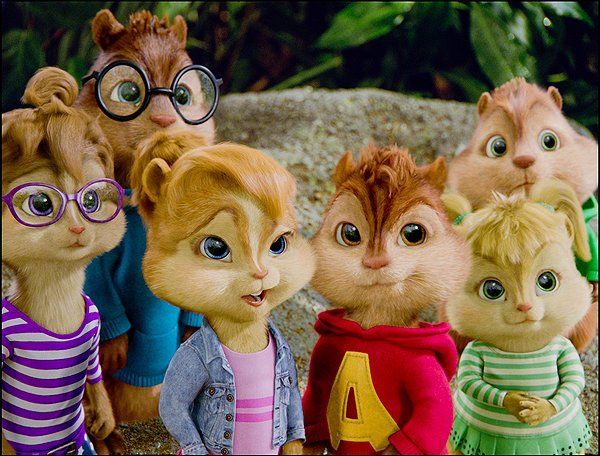 The Chipmunks and Chipettes smiling together in a natural outdoor setting.