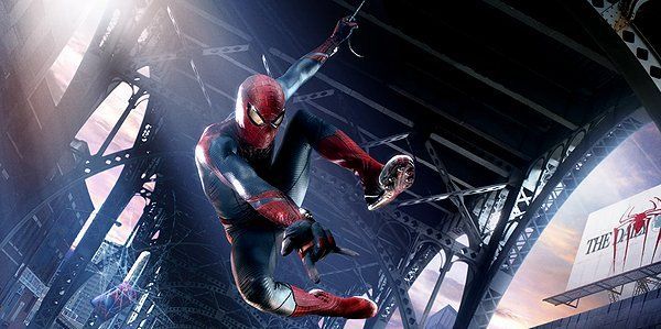 Spider-Man swings through a city, red and blue suit, holding a web.