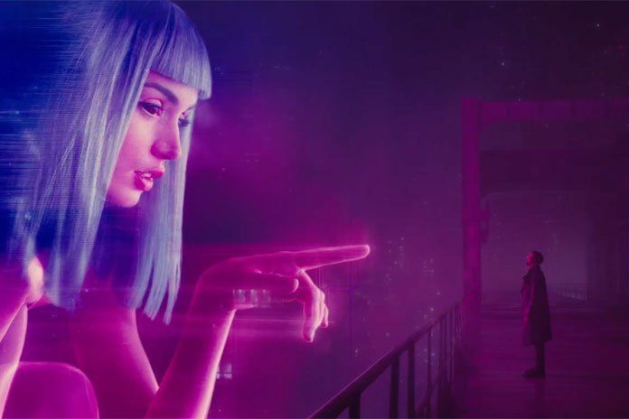 A woman in a blue wig points at a man in a futuristic, purple-lit setting.