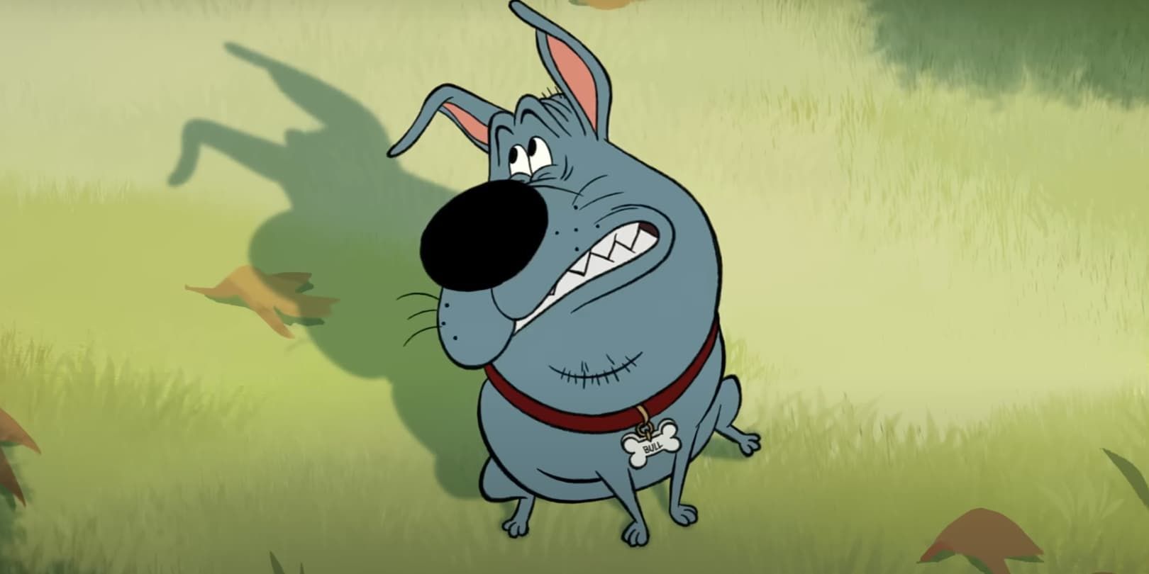Blue cartoon dog with a red collar grinning in a grassy field