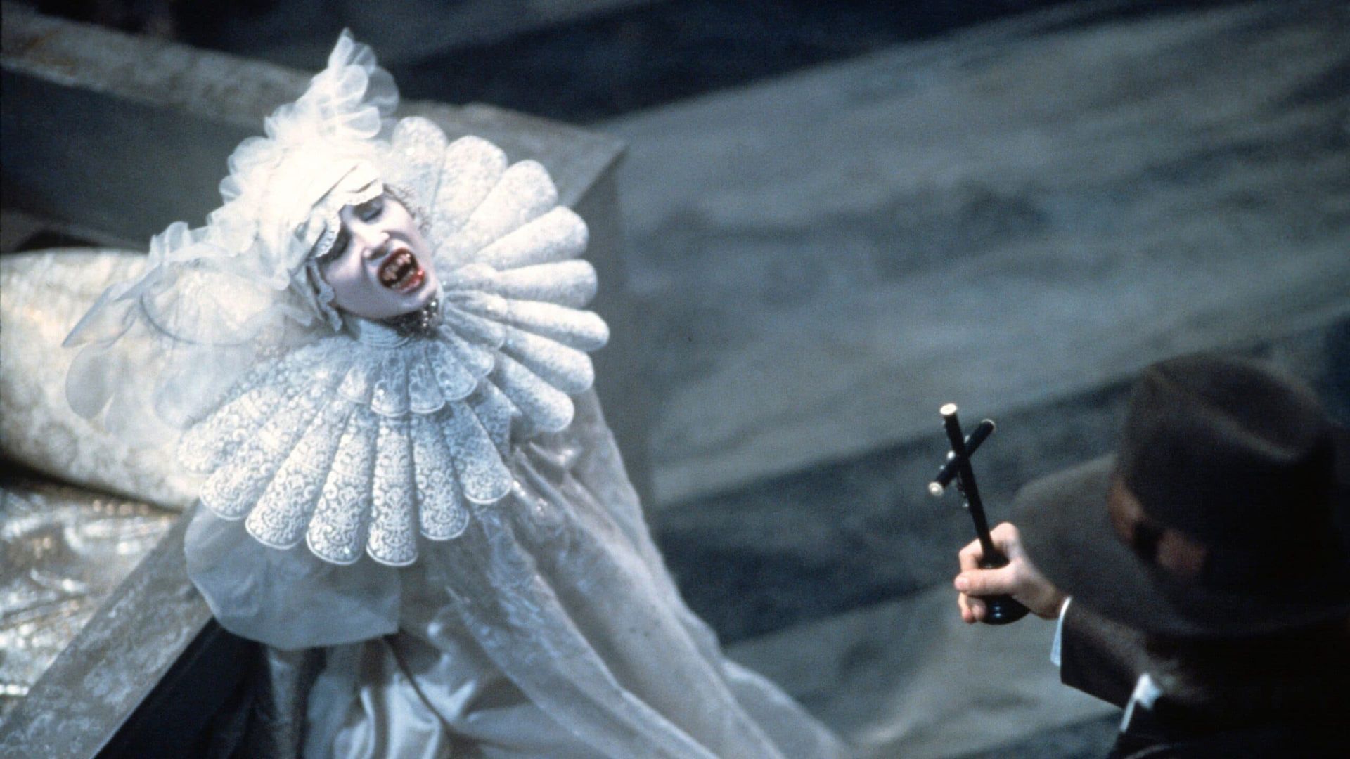 A white-clad figure with a ruffled collar faces a gunman in a gray outdoor setting.