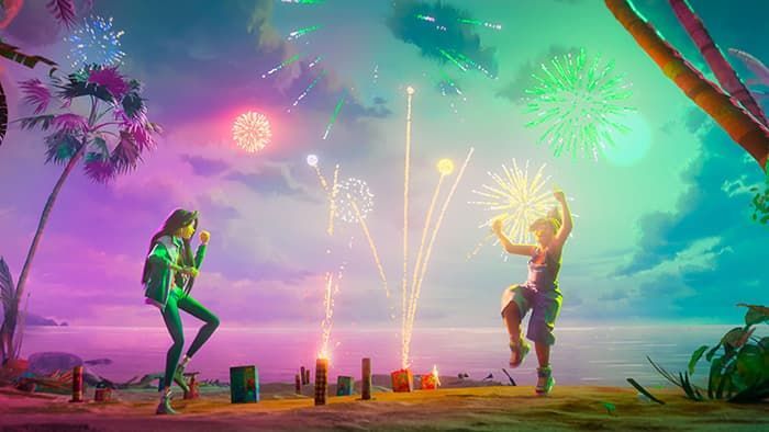 Two people dancing by a beach bonfire under colorful fireworks at sunset