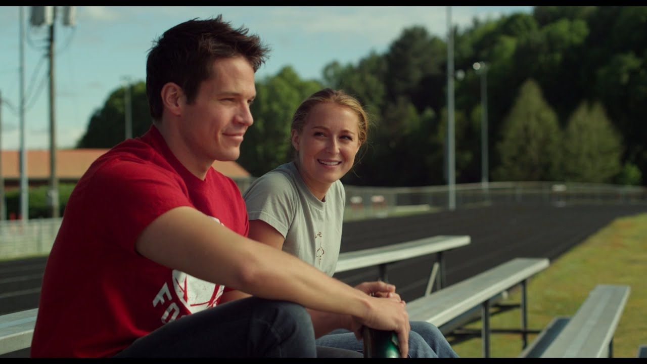Man in red shirt and woman in gray shirt