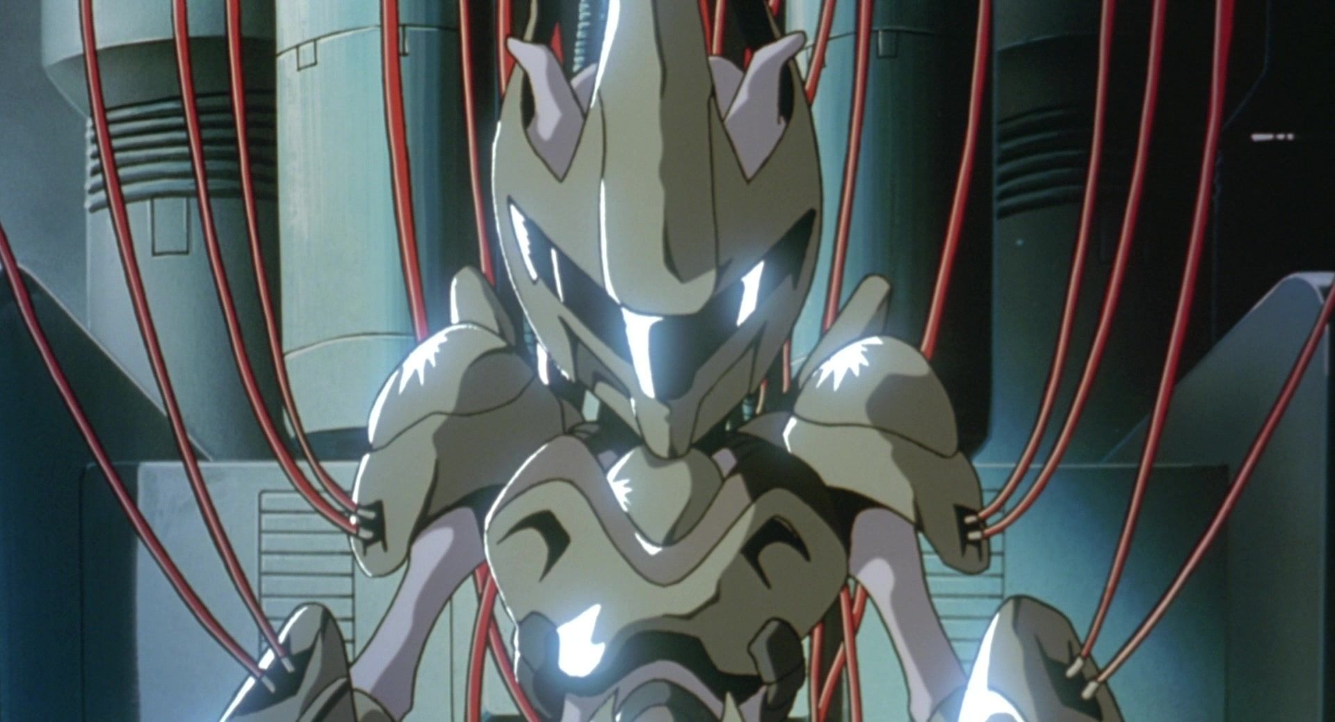 Humanoid robot with glowing blue eyes in a sci-fi chamber, surrounded by red cables