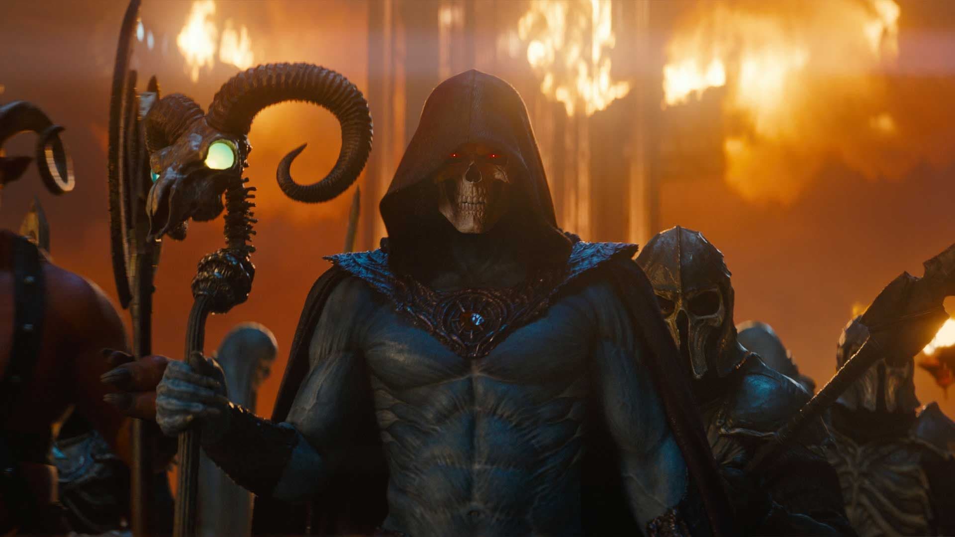 Hooded armored figure holding a staff amid flames and soldiers in a fiery battle scene