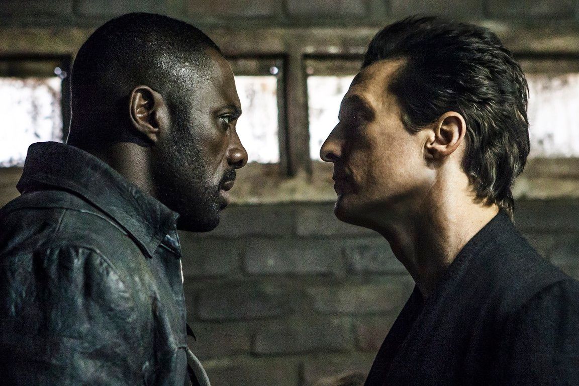 Two men face each other, intense expressions. Dark