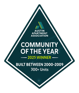 Austin Apartment Association “Community of the Year” winner badge, built between 2000–2009, 300+ units