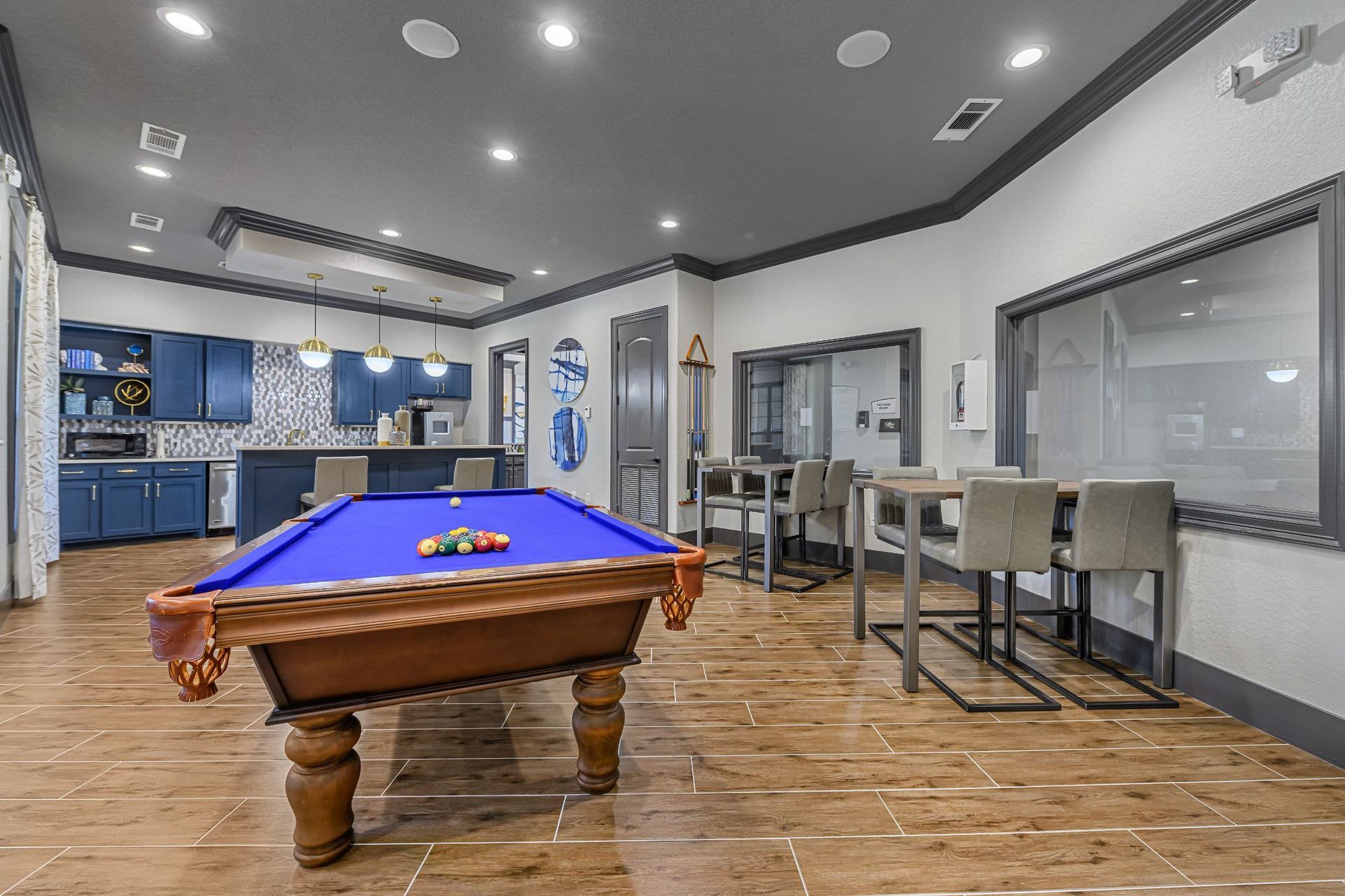 A pool table in the middle of the room at Marquis Lakeline Station in Austin, TX.