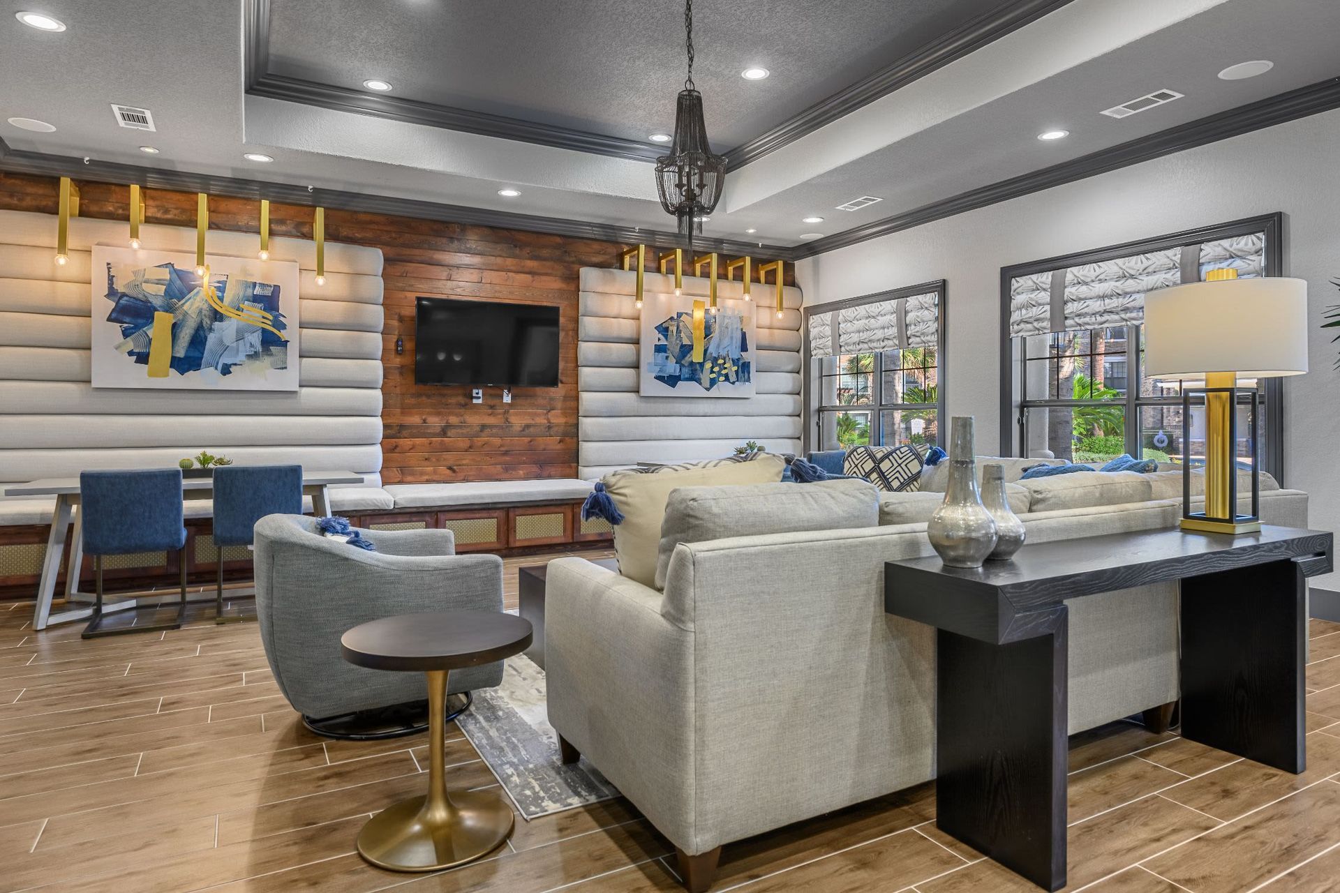 A living room filled with furniture and a flat-screen tv at Marquis Lakeline Station in Austin, TX.