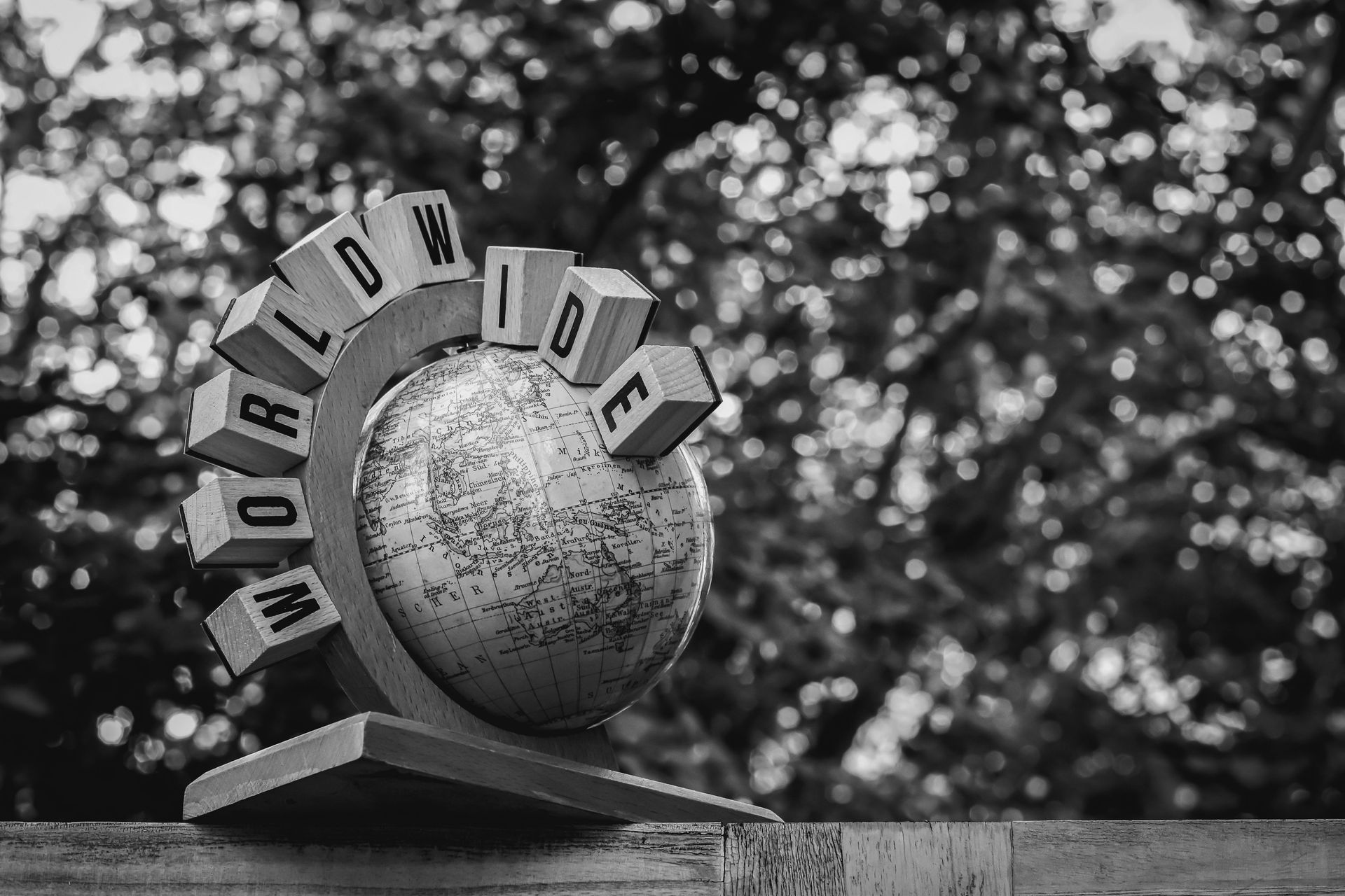 A world globe carved with the word Worldwide