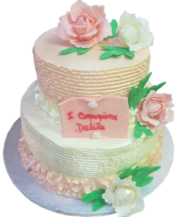 Una torta con fiori e un cartello con scritto i compagnia dalila
