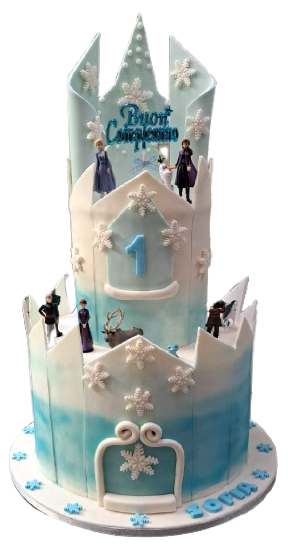 Una torta che sembra un castello ghiacciato con una corona in cima.