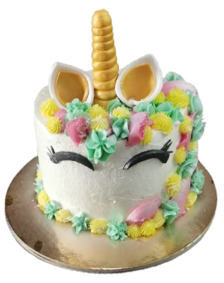 Una torta unicorno con fiori e un corno sopra.