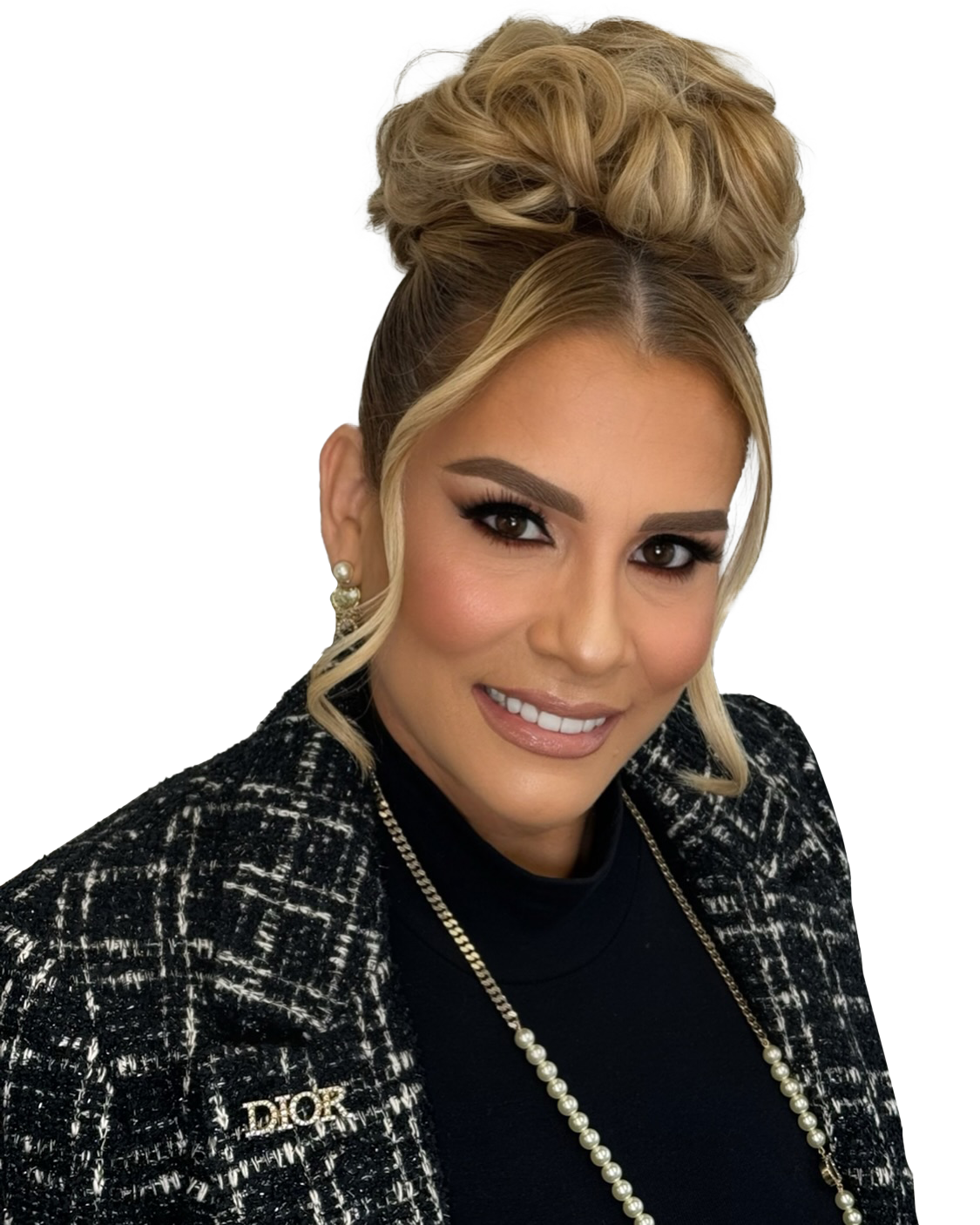 A woman wearing a black jacket with a dior brooch
