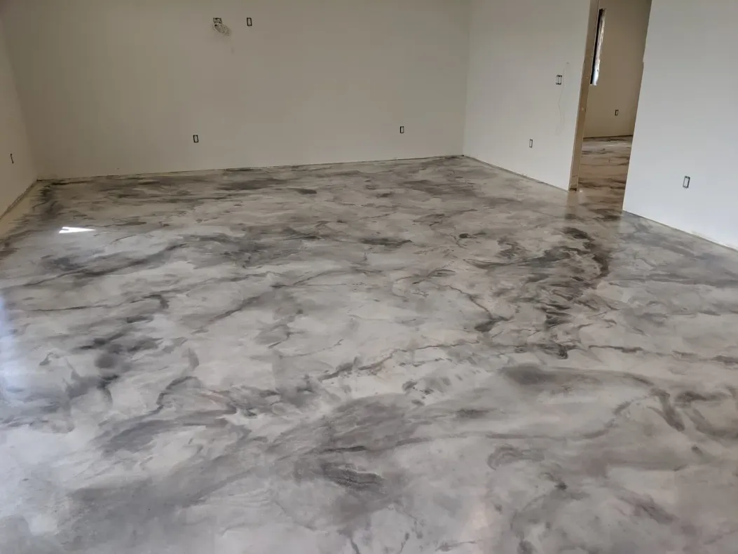 Empty room with glossy gray marbled floor and white walls, viewed from one corner
