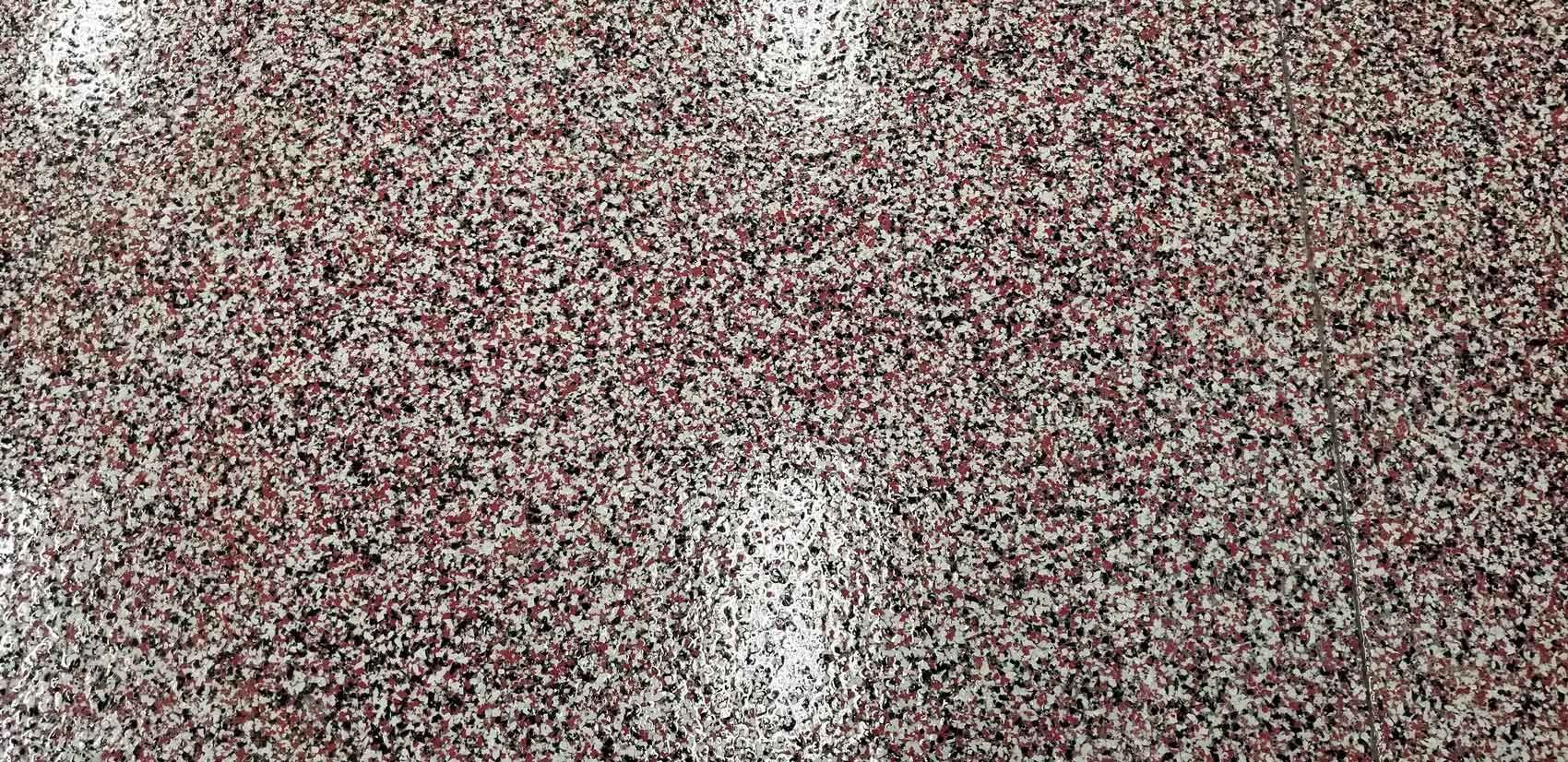 Static-like red, white, and gray speckled noise pattern covering the entire image