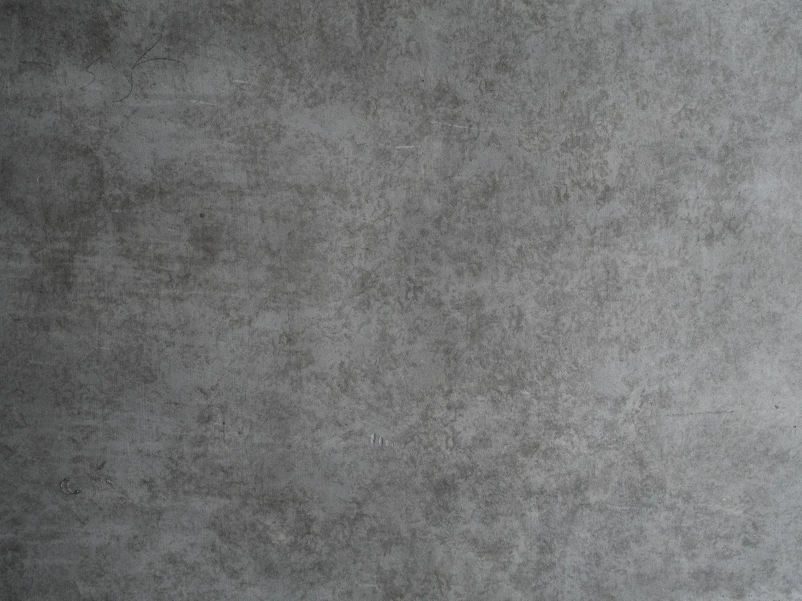 Gray mottled textured background with a subtle concrete-like pattern