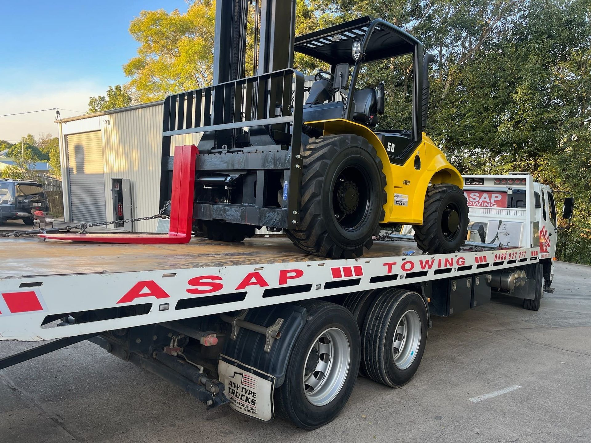 Yellow Forklift on a White Towing Truck — ASAP Towing Pty Ltd In Tiaro, QLD