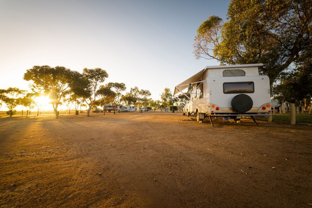 Motorhome Parked at a Campsite at Sunset — ASAP Towing Pty Ltd In Tin Can Bay, QLD