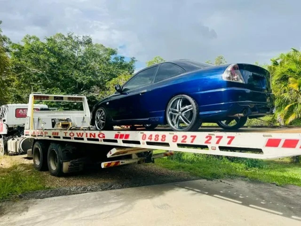 Blue Car on a Flatbed Tow Truck — ASAP Towing Pty Ltd In Tin Can Bay, QLD