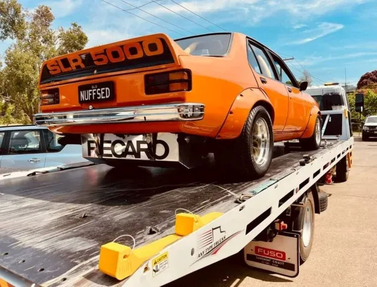 Orange Sedan on a Tow Truck — ASAP Towing Pty Ltd In Gympie, QLD