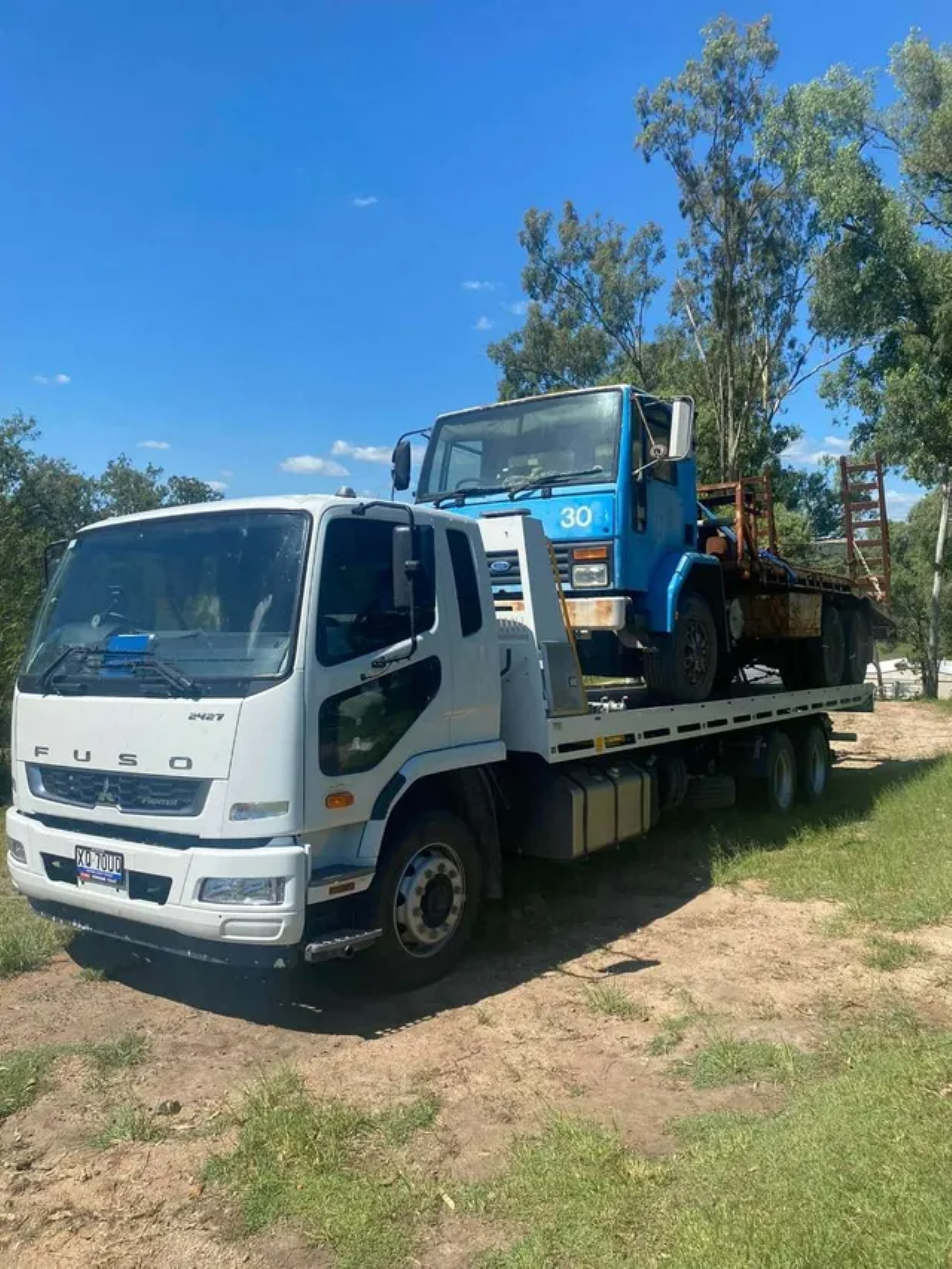 Green Sedan Being Loaded Onto a Yellow Tow Truck — ASAP Towing Pty Ltd In Gympie, QLD