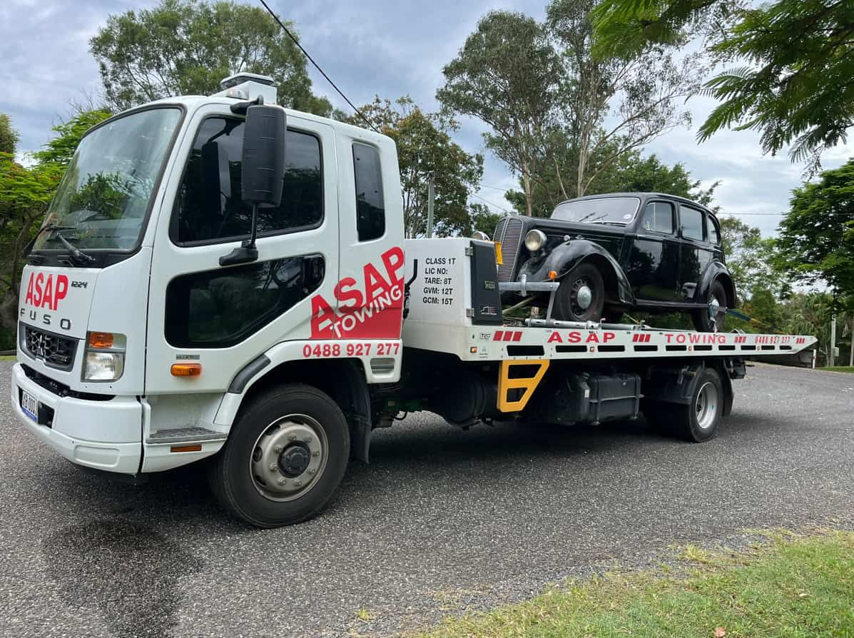 Tow Truck Carrying a Vintage Black Car — ASAP Towing Pty Ltd In Tin Can Bay, QLD