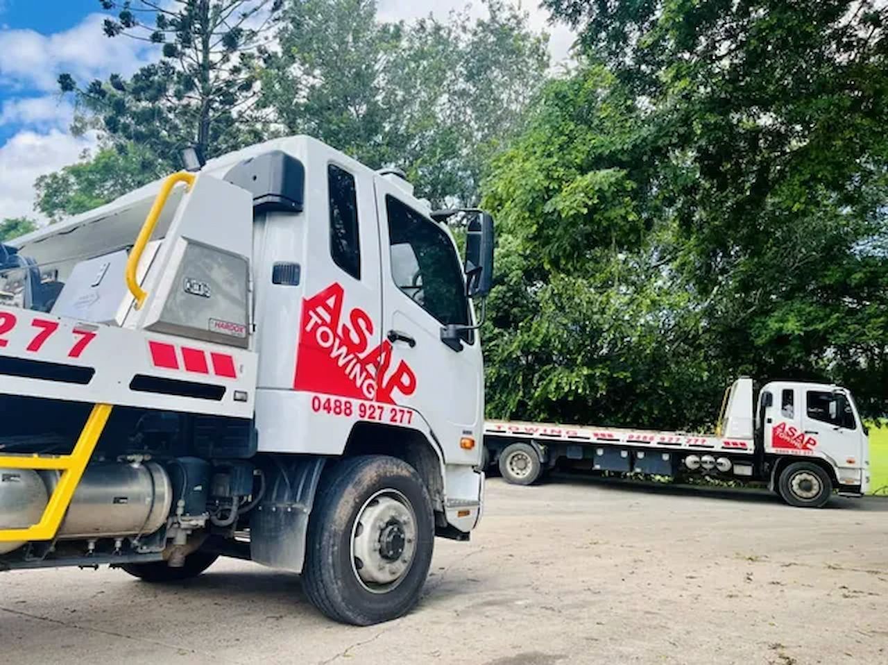 Two White Towing Trucks Parked on a Road — ASAP Towing Pty Ltd In Tiaro, QLD