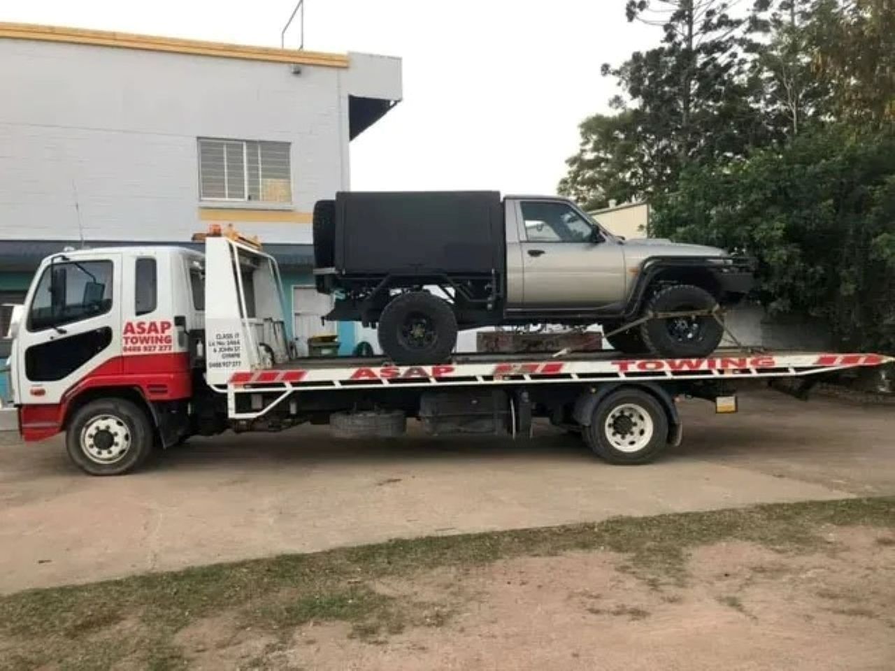 Tow Truck With a Black Vintage Car on the Flatbed — ASAP Towing Pty Ltd In Cooroy, QLD