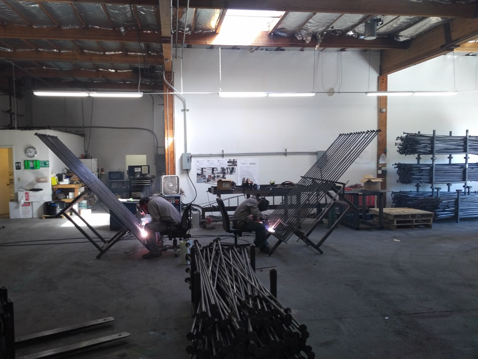 JSW team fabricating mat slab stud rails in the workshop