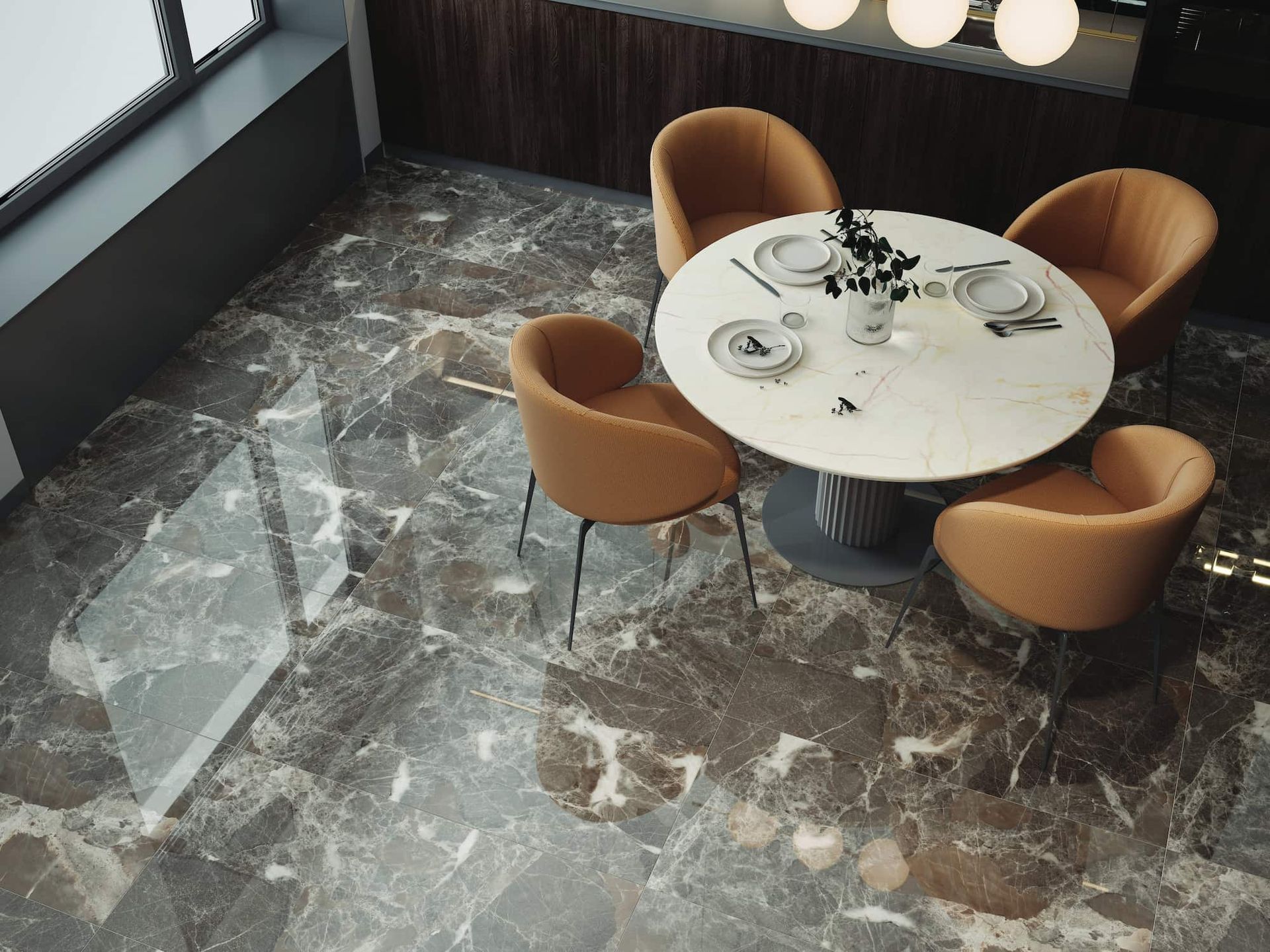Dining area with round table, four orange chairs, and marble-patterned floor.